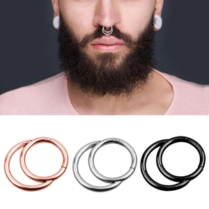 Three-color steel nose rings set in rose gold, silver, and black with clicker closure