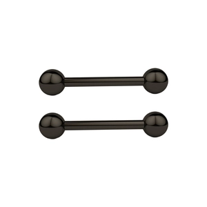 Macro view of two black stainless steel barbells for nipple or bridge piercings