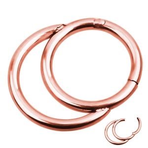 Detail view of rose gold seamless hinged nose rings showing clicking mechanism