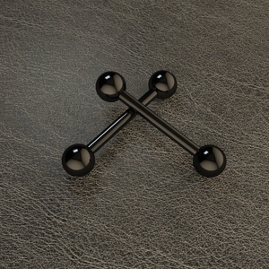 Macro shot of two black polished stainless steel straight barbell nipple rings on leather