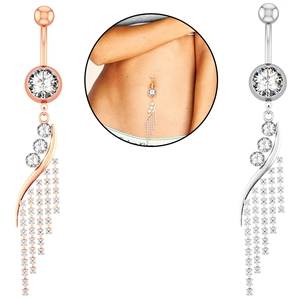 Detail of rose gold and silver navel rings with cubic zirconia and chain tassels