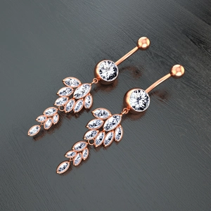 Close-up of rose gold navel rings with marquise zircon leaves on a black texture