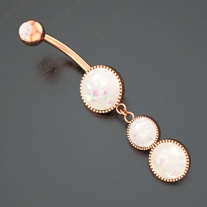 Detailed macro shot of rose gold belly ring featuring four inlaid white round opal stones