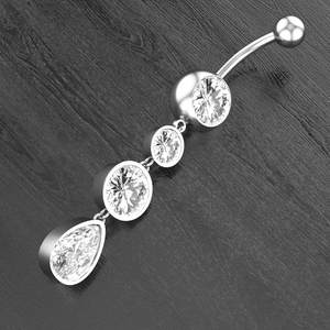 Macro detail of curved navel ring featuring polished leaf-shaped marquise cubic zirconia