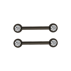 Detail of stainless steel barbell piercing with sparkling clear cubic zirconia crystals