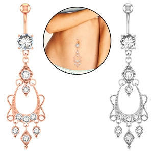 Detailed view of dangling belly rings in rose gold and silver with zircon inlays