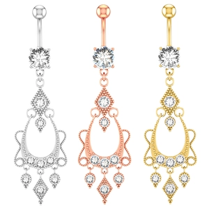 Detailed view of vintage navel rings with cubic zirconia in silver, gold, and rose gold