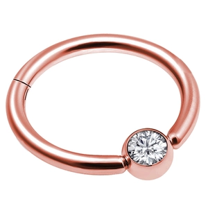 Macro detail of rose gold nose ring clicker featuring a round sparkling zircon stone