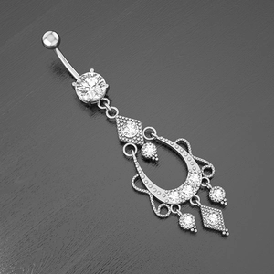 Macro detail of bohemian chandelier belly ring with sparkling zircon and silver finish