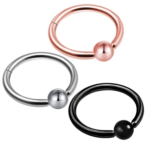 Three-color surgical steel septum clickers with ball details in silver, gold, and black