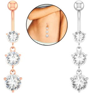 Macro detail of belly rings featuring three vertical zircon stones in rose gold and silver