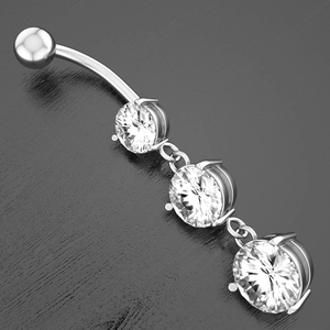 Macro view of silver navel ring with three cascading round-cut cubic zirconia stones
