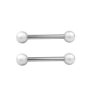 Macro detail of stainless steel barbell piercing jewelry with glitter finish frosted balls