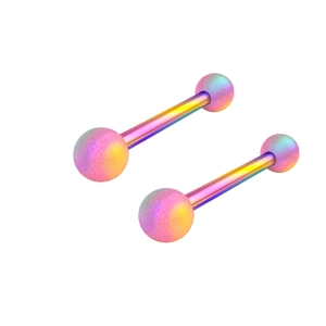 Detailed macro view of rainbow iridescent stainless steel barbell piercing studs