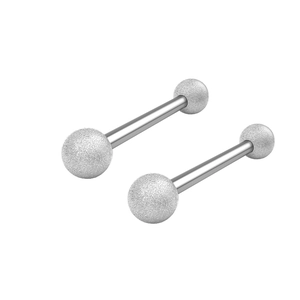 Macro view of stainless steel barbell piercing jewelry with glitter frosted texture balls