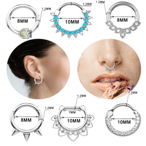 Polished stainless steel nose rings with zircon and opal stones, shown in various sizes