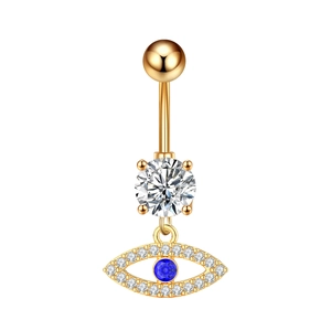 Detail of gold navel ring featuring a blue evil eye pendant with sparkling zircons