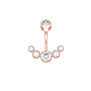 Macro shot of rose gold navel ring featuring six sparkling round-cut crystals