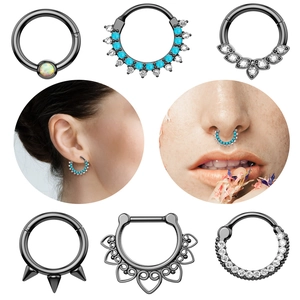 Black stainless steel nose ring set with zircon and turquoise on a model