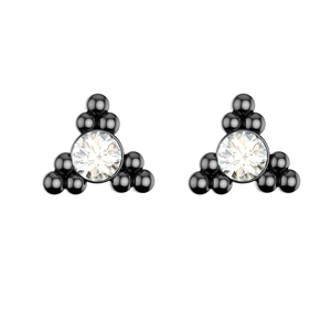 Macro shot of black coated metal ear studs with centered sparkling clear zircon stones