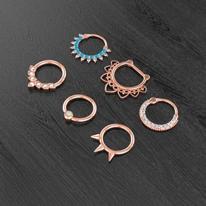 Detailed 3D render of rose gold nose rings featuring blue beads and zircon accents