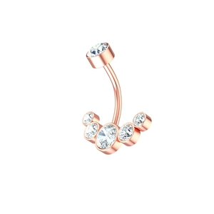 Macro view of rose gold navel ring with six sparkling clear cubic zirconia stones