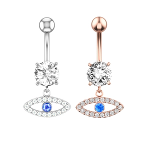 Detail of evil eye belly button rings in silver and rose gold with zircon inlay