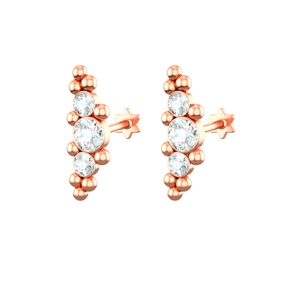 Detailed view of rose gold stud earrings with three round zircons and flat star backs
