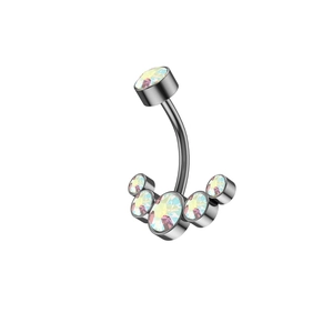 Macro shot of silver stainless steel belly ring with arc-shaped rainbow zircon crystals