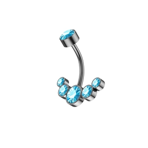 Macro shot of curved navel ring with six light blue rhinestones in a sleek metal setting