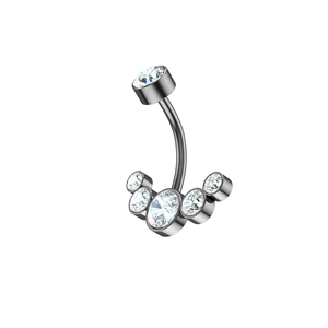 Macro view of gunmetal stainless steel belly ring featuring five clear CZ stones in a fan shape