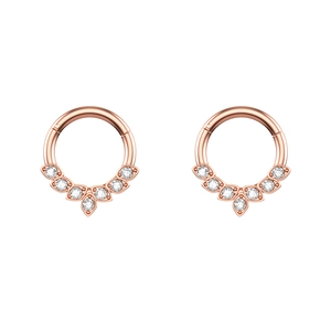 Close-up of rose gold hinged hoops featuring seven sparkling inlaid zircon stones