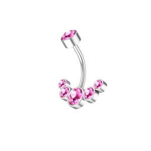 Close-up of pink crystal belly button ring with polished steel bar and gemstone cluster