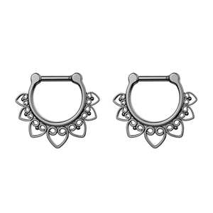 Close-up of dark grey stainless steel nose rings with bohemian hollow heart patterns