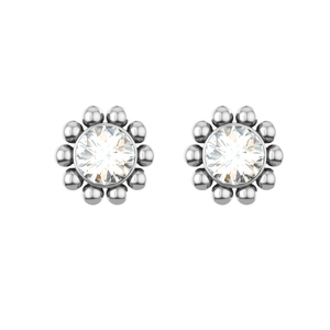 Close-up of sparkling round zircon stud earrings with beaded silver metal borders