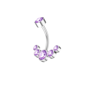 Detailed macro view of curved barbell belly ring with purple cubic zirconia stones