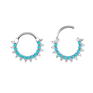 Detail of silver stainless steel hoop earrings with turquoise and zircon stones