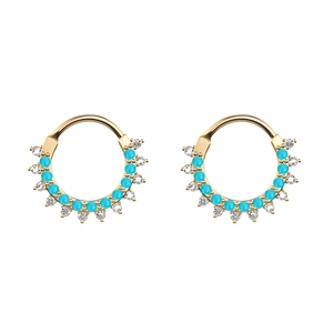 Macro shot of gold-plated hoop with turquoise beads and sparkling cubic zirconia stones