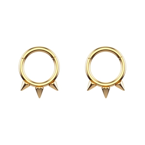 Detailed view of golden stainless steel clicker hoop earrings with triple spike punk design