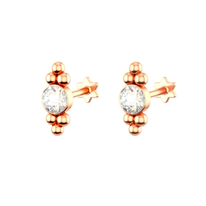 Detailed view of rose gold piercing studs with cubic zirconia and star screw backs