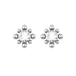 Macro detail of starburst silver earrings with round cubic zirconia and small metal spheres