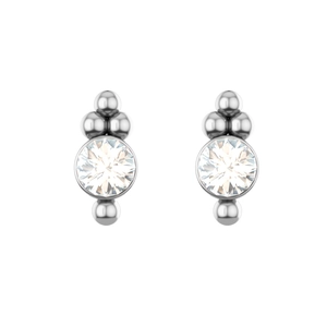 Macro shot of a geometric silver stud earring with a round Czech crystal and ball accents