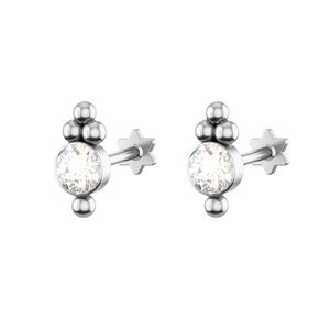Detailed close-up of crystal stud earrings with star-shaped flat back for body piercing