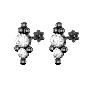 Detail view of black stainless steel labret stud with Czech crystals and star base