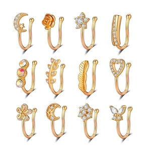 Lot de 12 faux piercings de nez dorés avec zircons en formes d'étoiles et de lunes