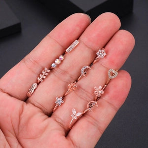 Parure de bijoux de piercing or rose avec zircons, designs de feuilles et lune étoilée