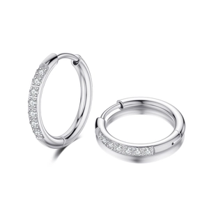 Detailed close-up of silver hoop earrings with pavé set cubic zirconia on white background