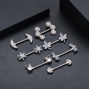 Silver surgical steel nipple rings with cubic zirconia in floral and snake designs