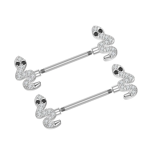 Macro shot of silver snake nipple barbells with white zircons and black gemstone eyes