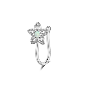 Detailed macro view of silver flower faux nose ring with light blue opal inlay